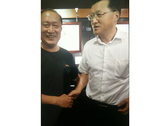 戴吉阳与青岛市政协主席杨军在一起